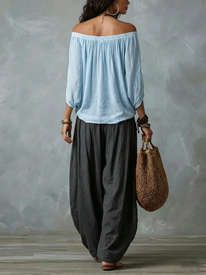 Joryna - Set composto da top asimmetrico e pantaloni palazzo larghi