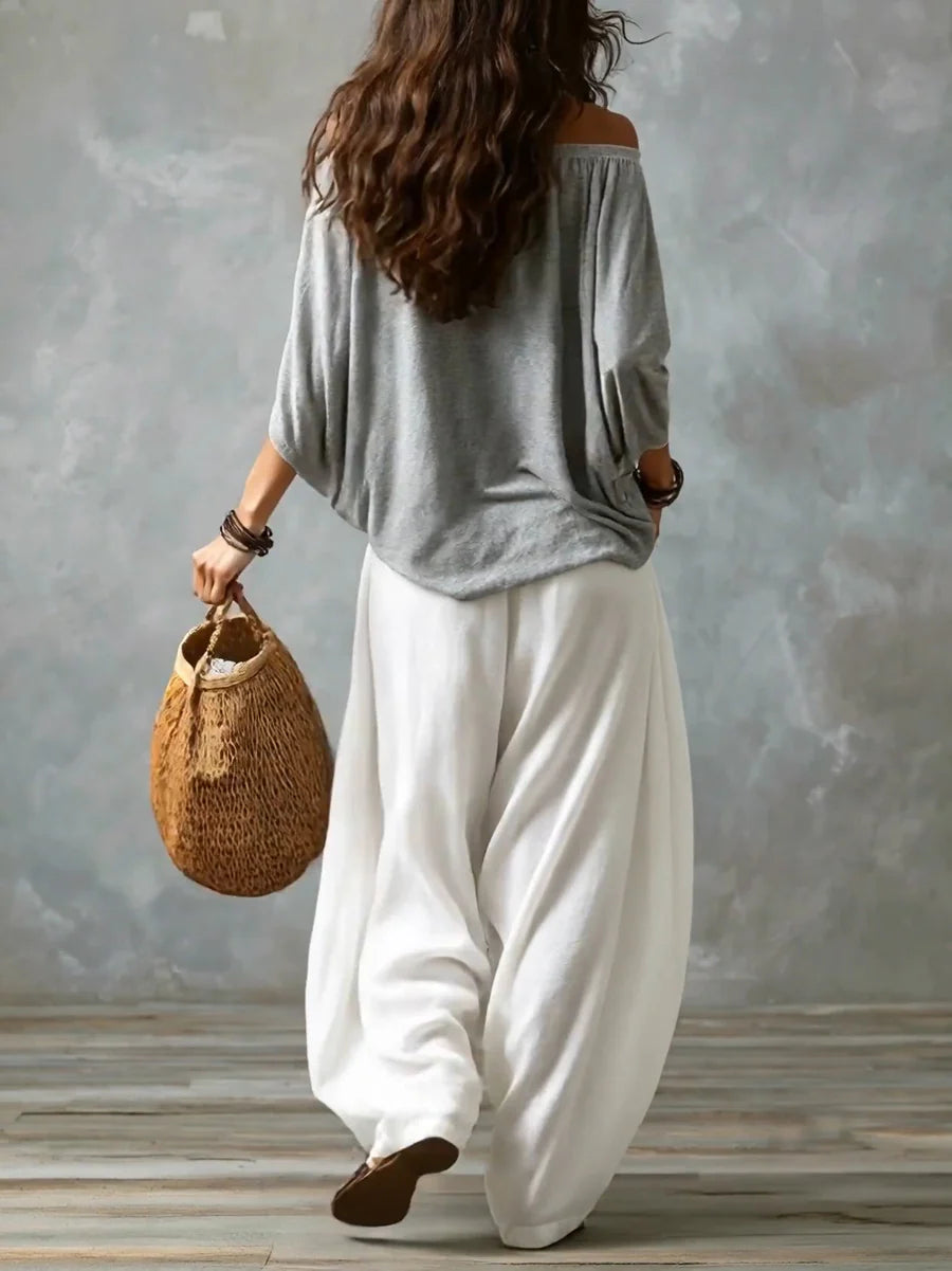 Joryna - Set composto da top asimmetrico e pantaloni palazzo larghi