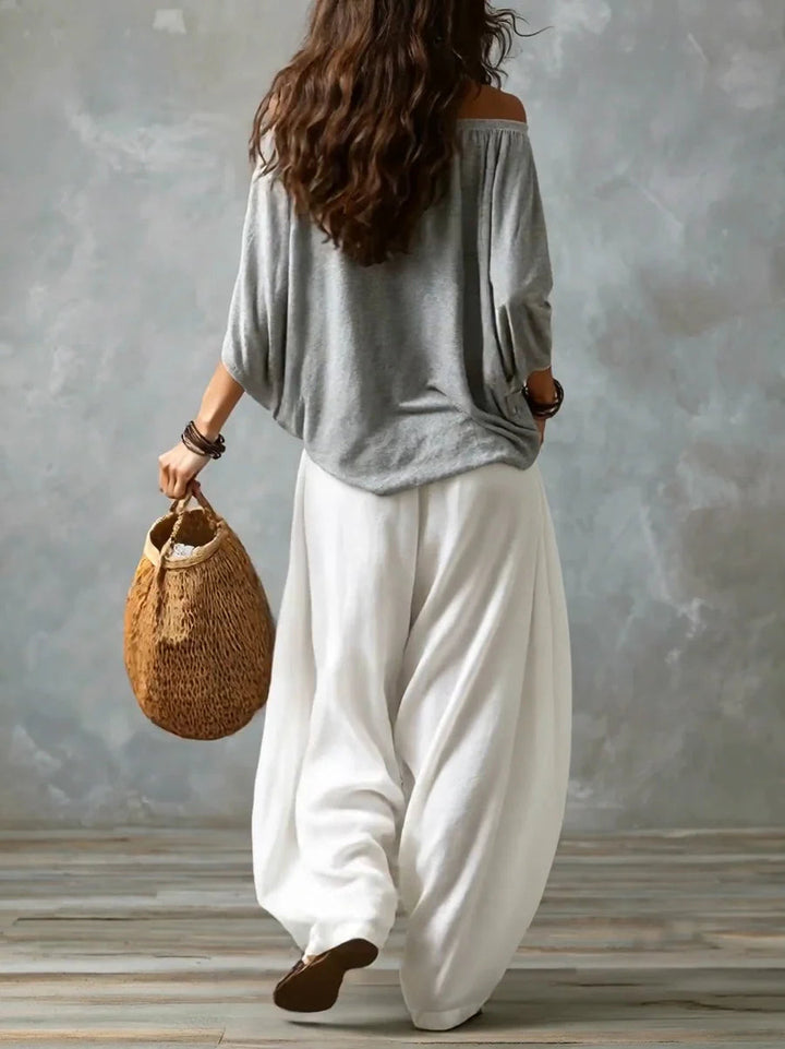 Joryna - Set composto da top asimmetrico e pantaloni palazzo larghi