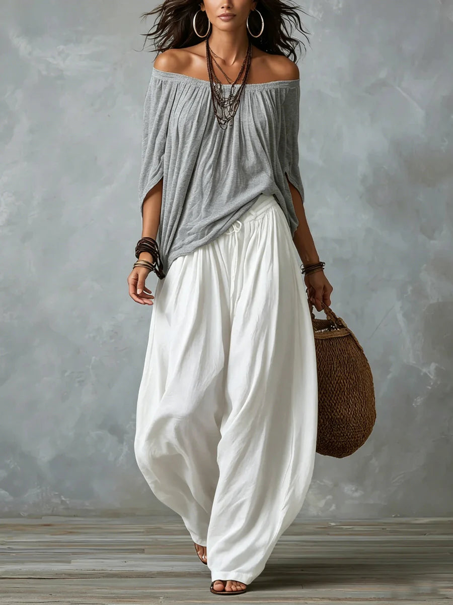 Joryna - Set composto da top asimmetrico e pantaloni palazzo larghi