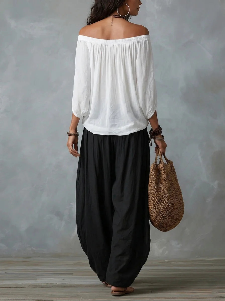 Joryna - Set composto da top asimmetrico e pantaloni palazzo larghi