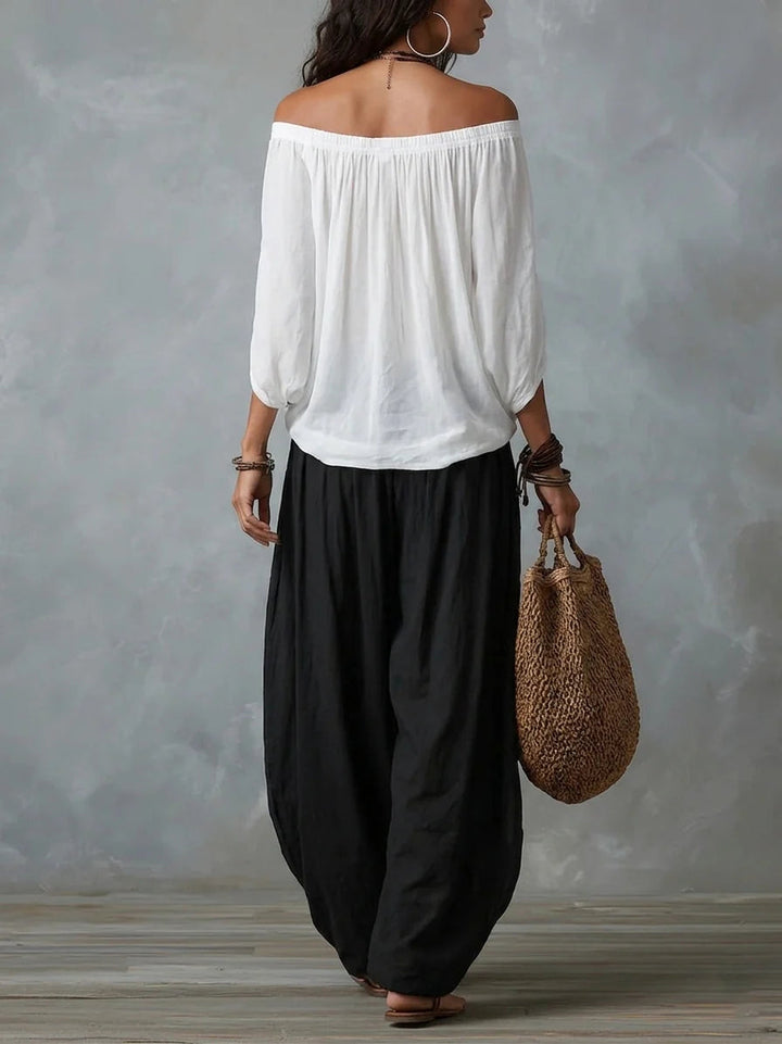 Joryna - Set composto da top asimmetrico e pantaloni palazzo larghi