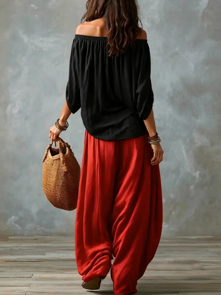 Joryna - Set composto da top asimmetrico e pantaloni palazzo larghi