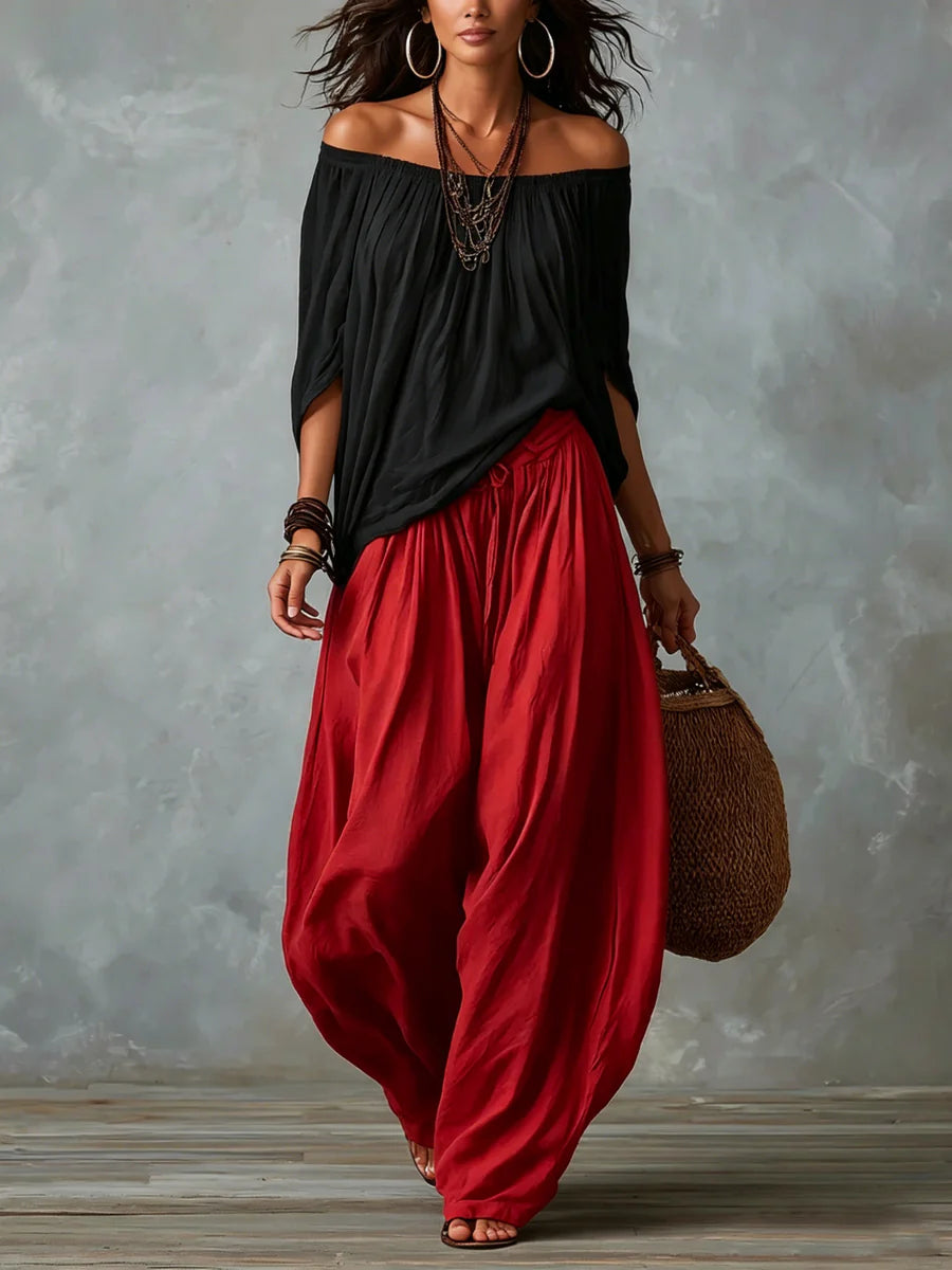 Joryna - Set composto da top asimmetrico e pantaloni palazzo larghi