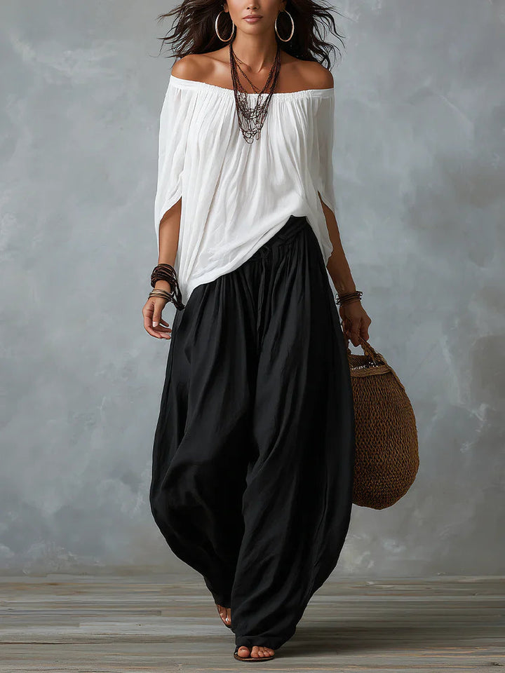 Joryna - Set composto da top asimmetrico e pantaloni palazzo larghi